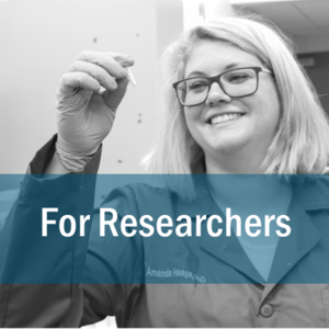 link to the page for researchers, the button photo shows a researcher looking at a test tube.