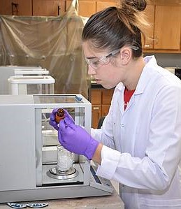 Minot undergraduate Erin Winterton in the lab.